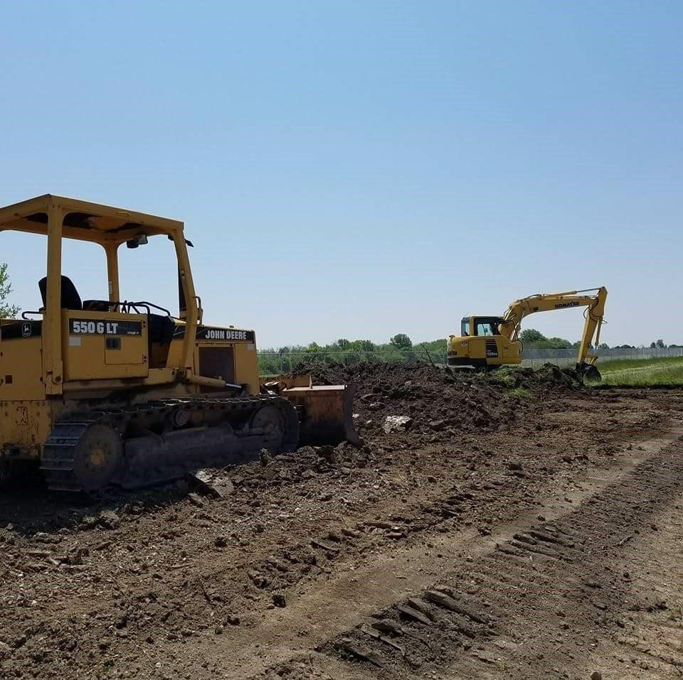 Excavators on The Lot Space — Northwood, OH — D & D Paving Inc.
