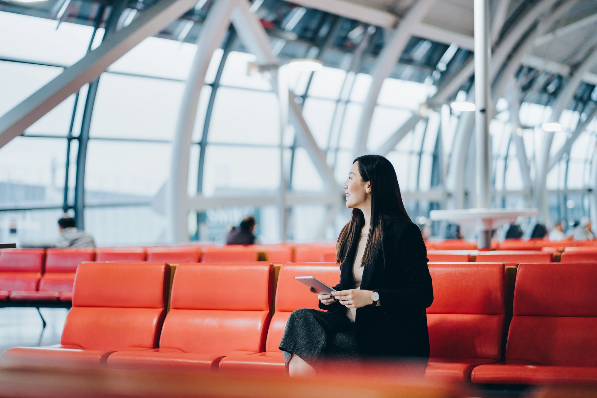 A Woman Sitting in Waiting Area of the Airport - Melbourne, VIC - Work4U Group Pty Ltd