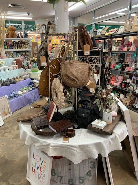 Bags, Books And Frame On The Shop Display — Gifts And Flowers In Blackwater, QLD