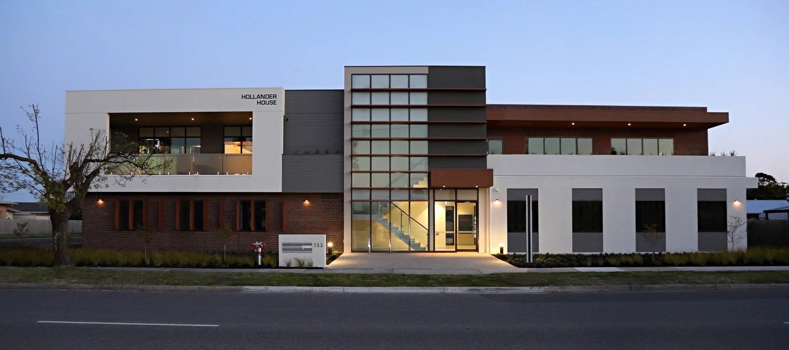 A large building with a lot of windows and a balcony