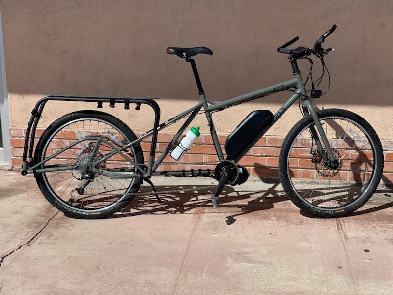 An E-Bike leaning against a wall