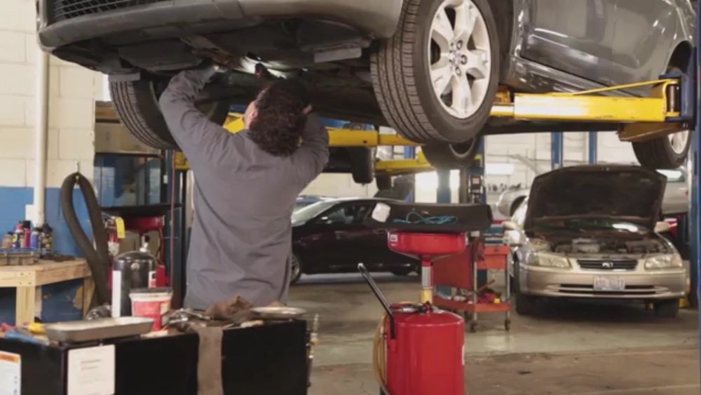 Mechanic working on a car engine