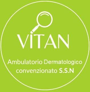 Logo for Vitan Dermatology Clinic: green circle, magnifying glass, text 
