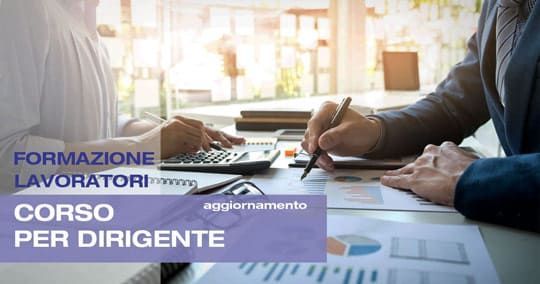 Two people at a table, working. Text: