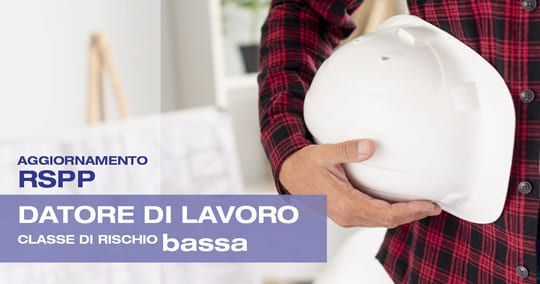 Man holding a white hard hat, text