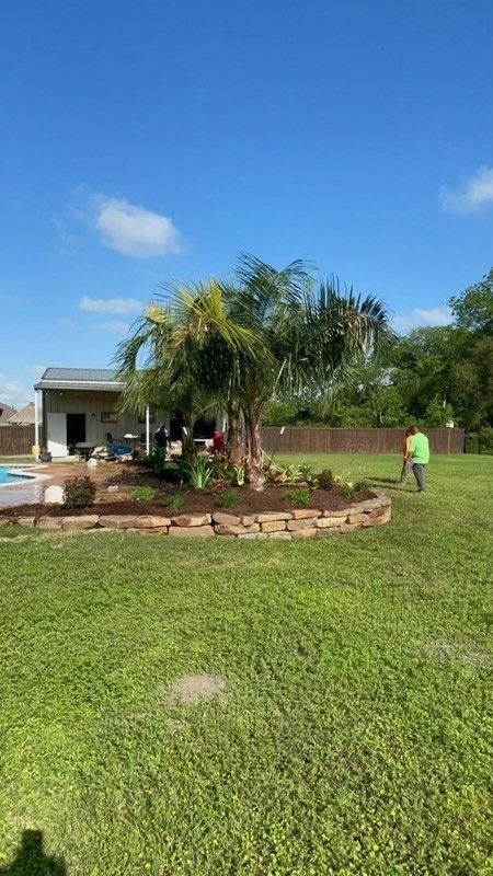 A lush green lawn with a pool in the background and a house in the background.