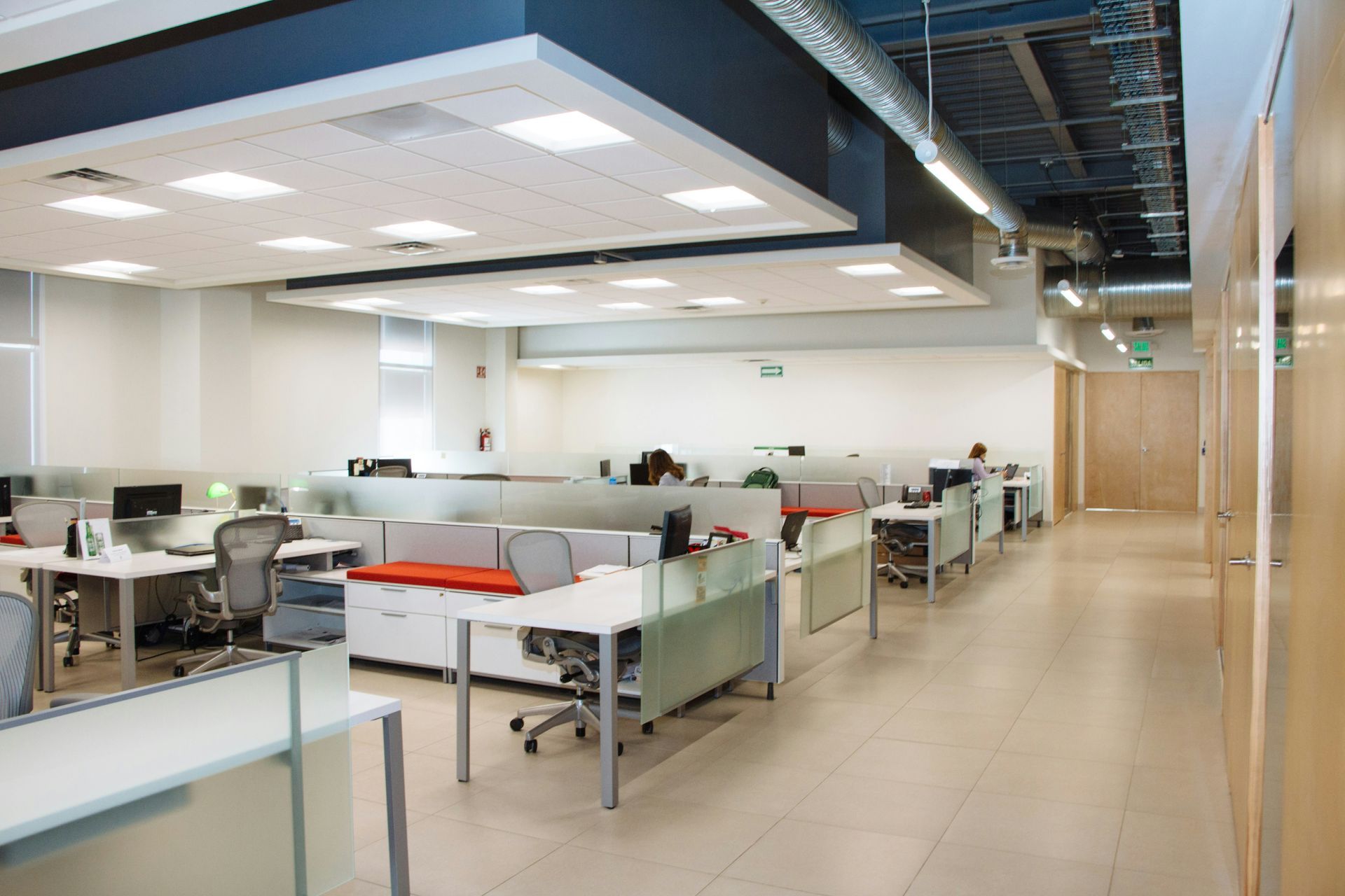 A large office with a lot of desks and chairs