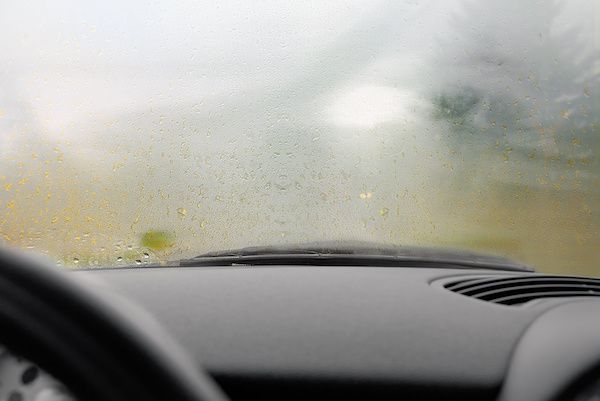 Foggy windshield from inside a car, obscuring the view. | Dave's Automotive LLC