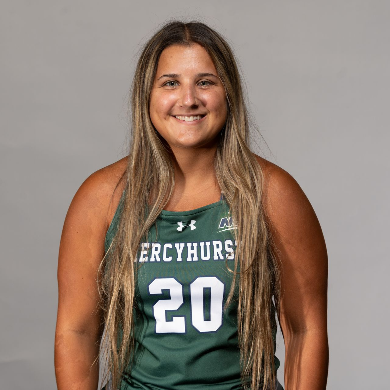 Woman in green jersey with