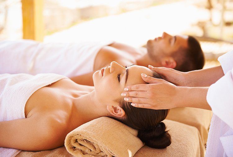 Couple Enjoying Enjoying Massage — Springfield, MO — Dharma Day Spa & Salon
