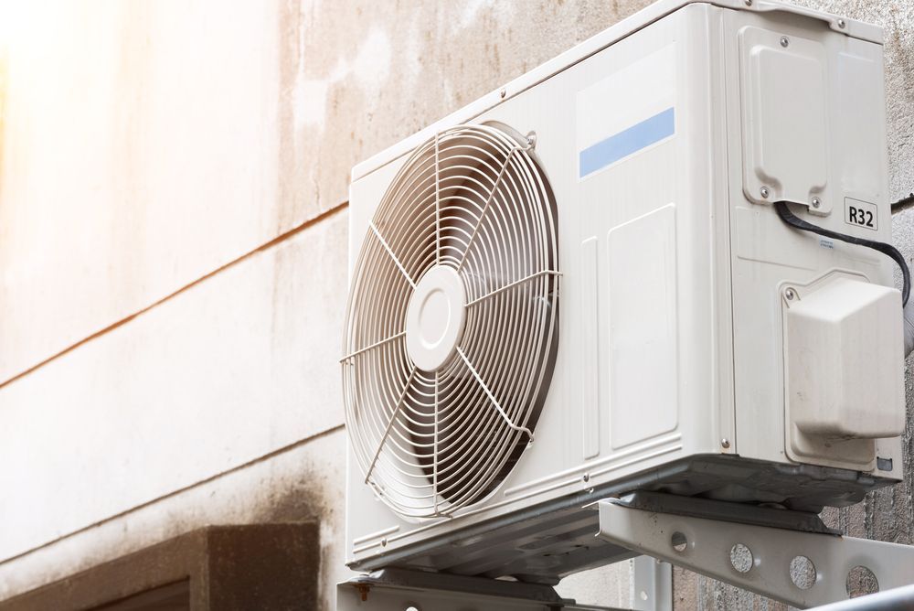 White Outdoor Air Conditioner Unit — Deltech HVACR in Georgetown, NSW