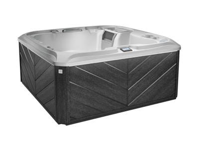 Square hot tub with gray and black exterior, light interior.
