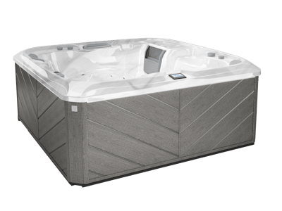 Gray hot tub with a light gray interior and chevron-patterned siding.