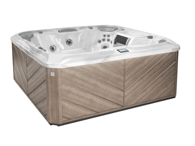 Hot tub with a light brown, angled wood-like exterior and a white interior.