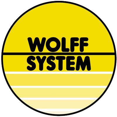 Yellow Wolff System logo with black text in a yellow circle, separated by a horizontal black line.