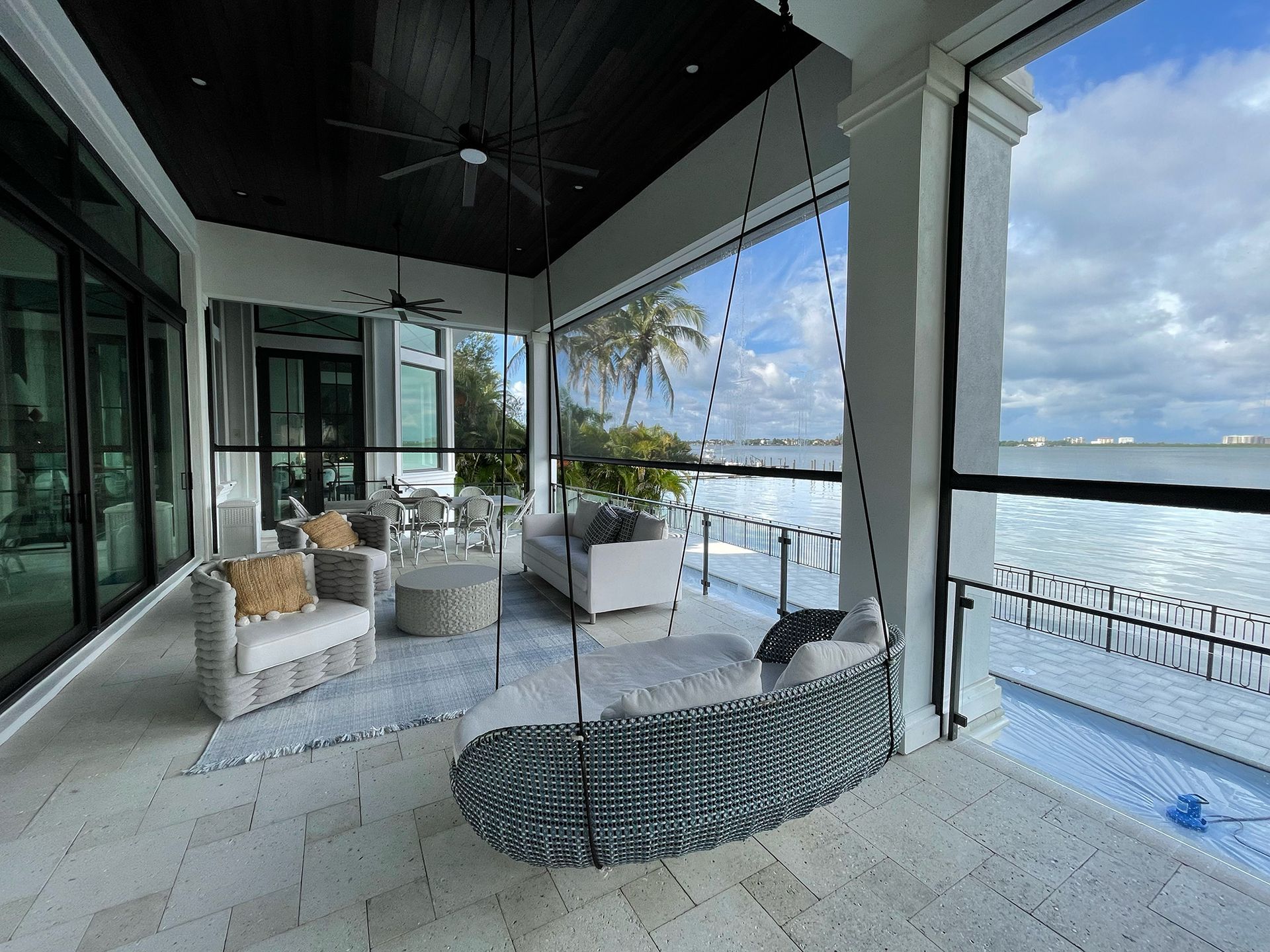 A large house with motorized patio screen