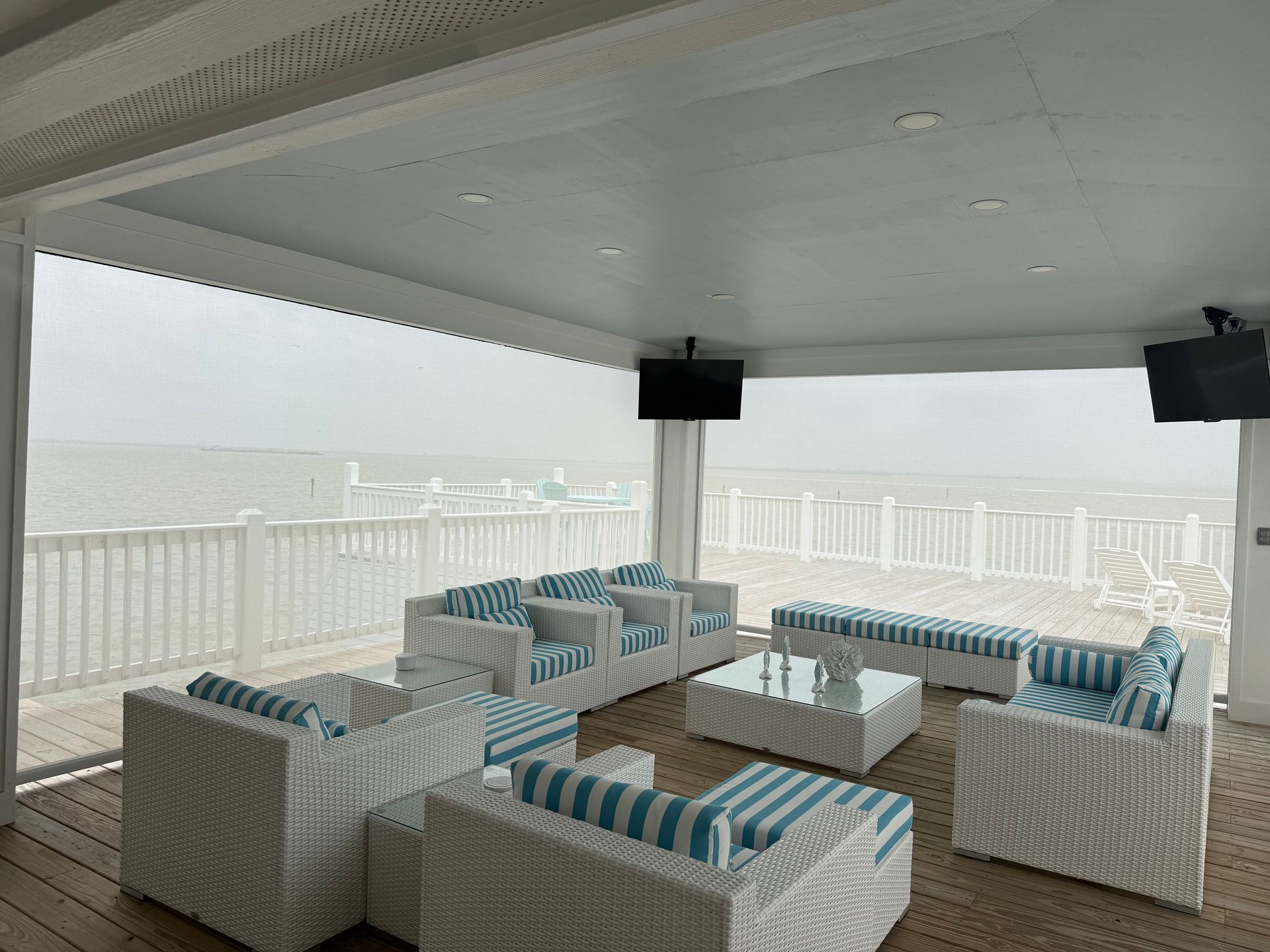 A patio with motorized patio screens