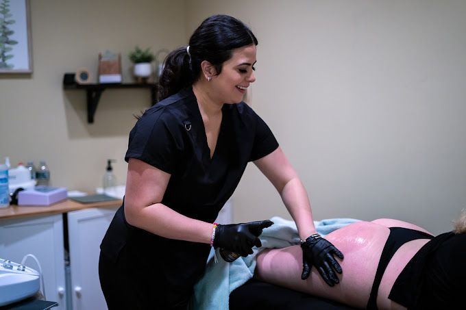 A woman is giving a woman a massage in a spa.