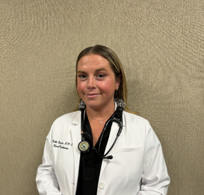 Kelli Duncan - Certified Nurse Practitioner in a lab coat smiling