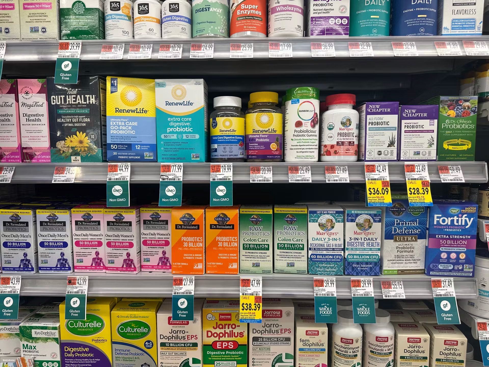 A shelf in a store filled with a variety of vitamins and supplements.