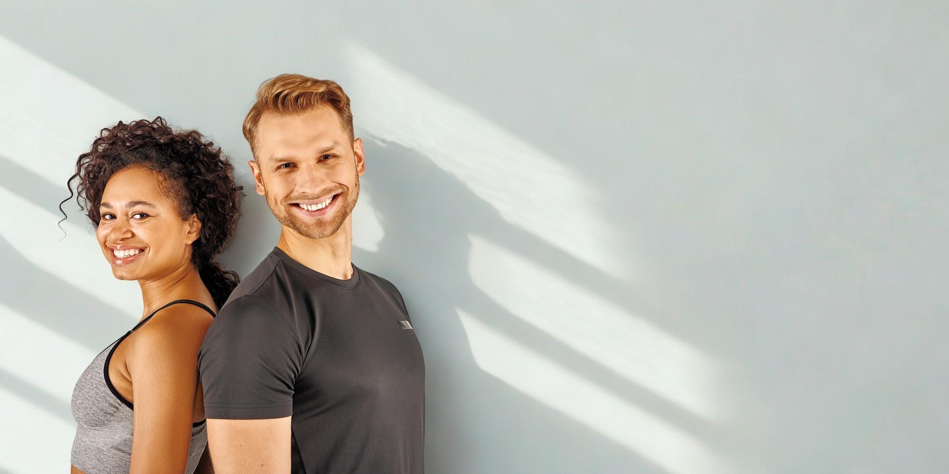 A man is giving a woman a massage in a chair at Meraki Integrative Wellness and Medspa