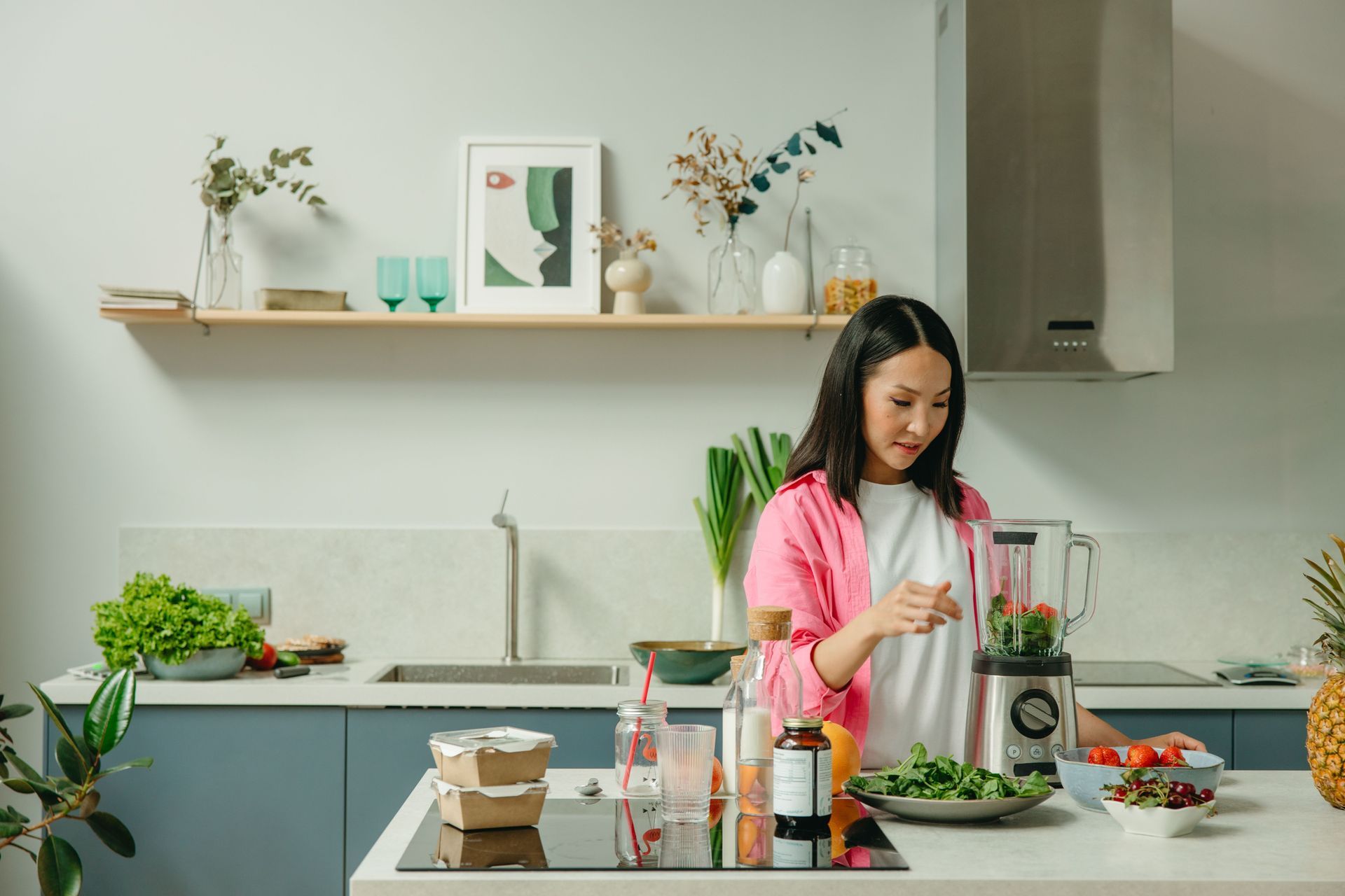 Warm lifestyle image of a calm NYC professional preparing a colorful, gut-supportive meal at home