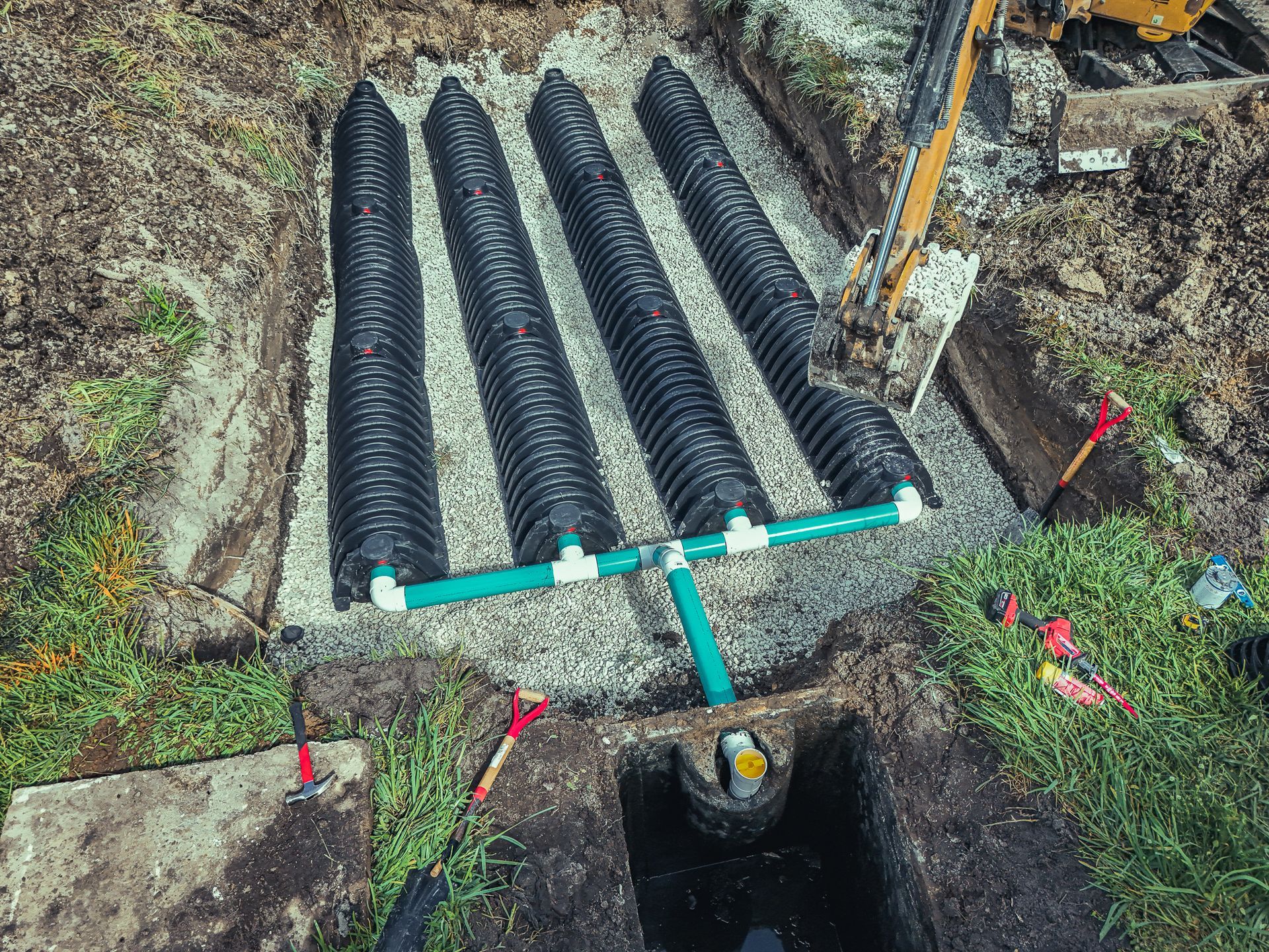 An aerial view of a septic system being installed in a yard.