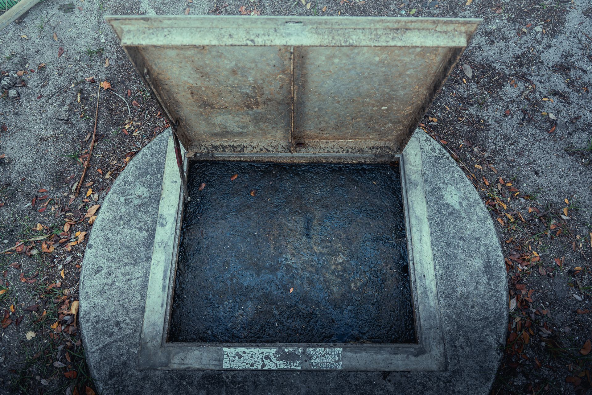 An aerial view of a well with the lid open.