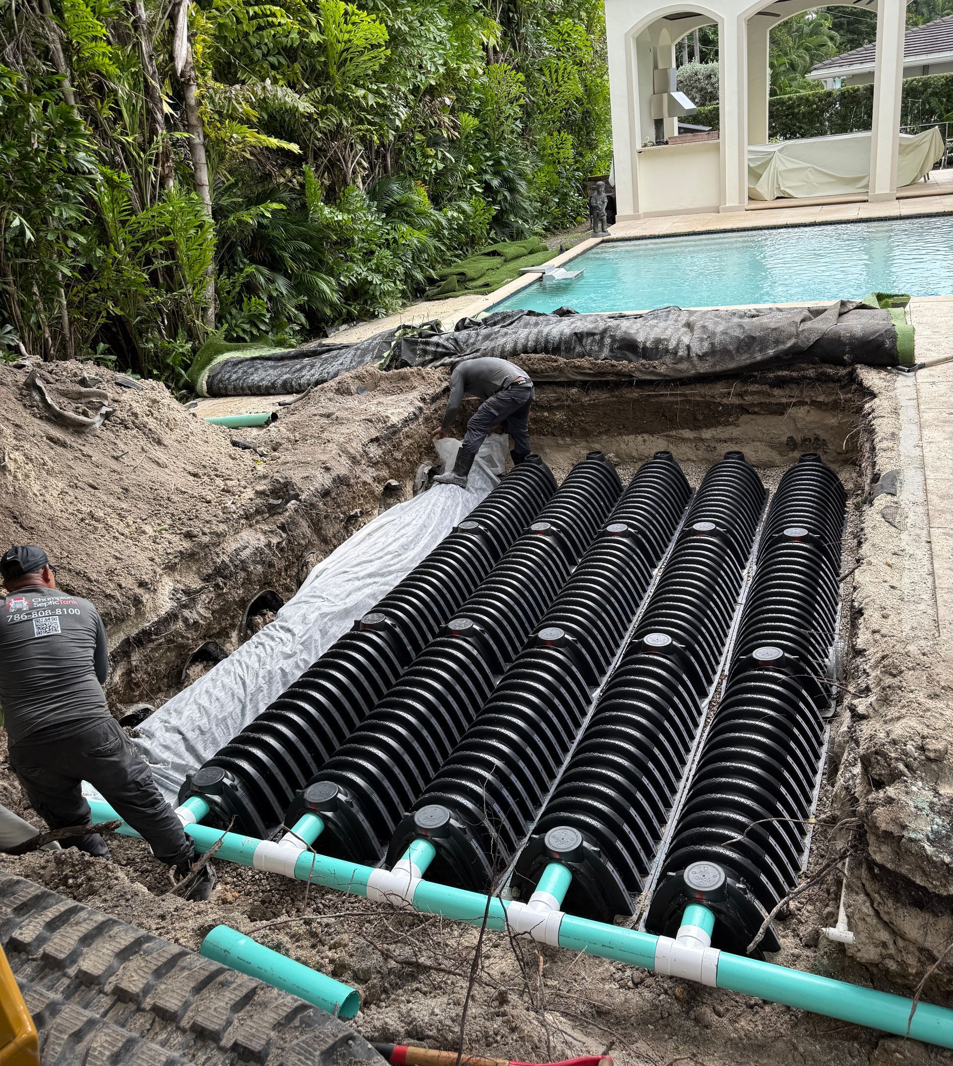 A close up of a green drain with a hole in the middle.