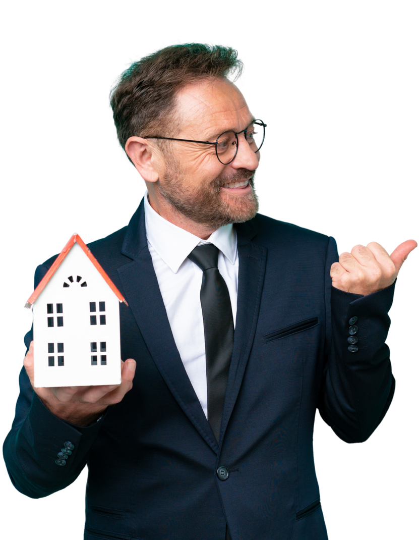A man in a suit and tie is holding a model house