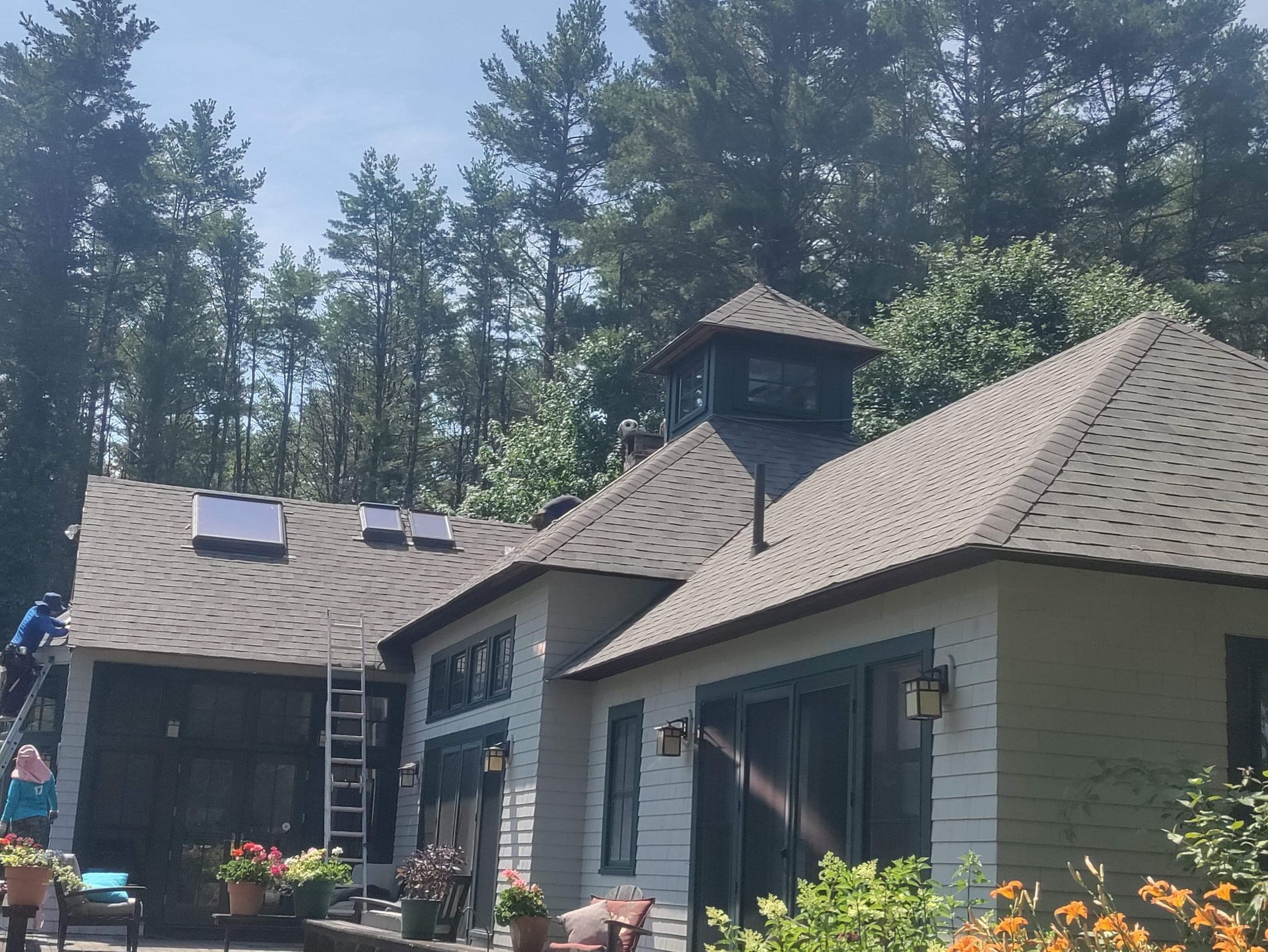 A house with a roof that has solar panels on it