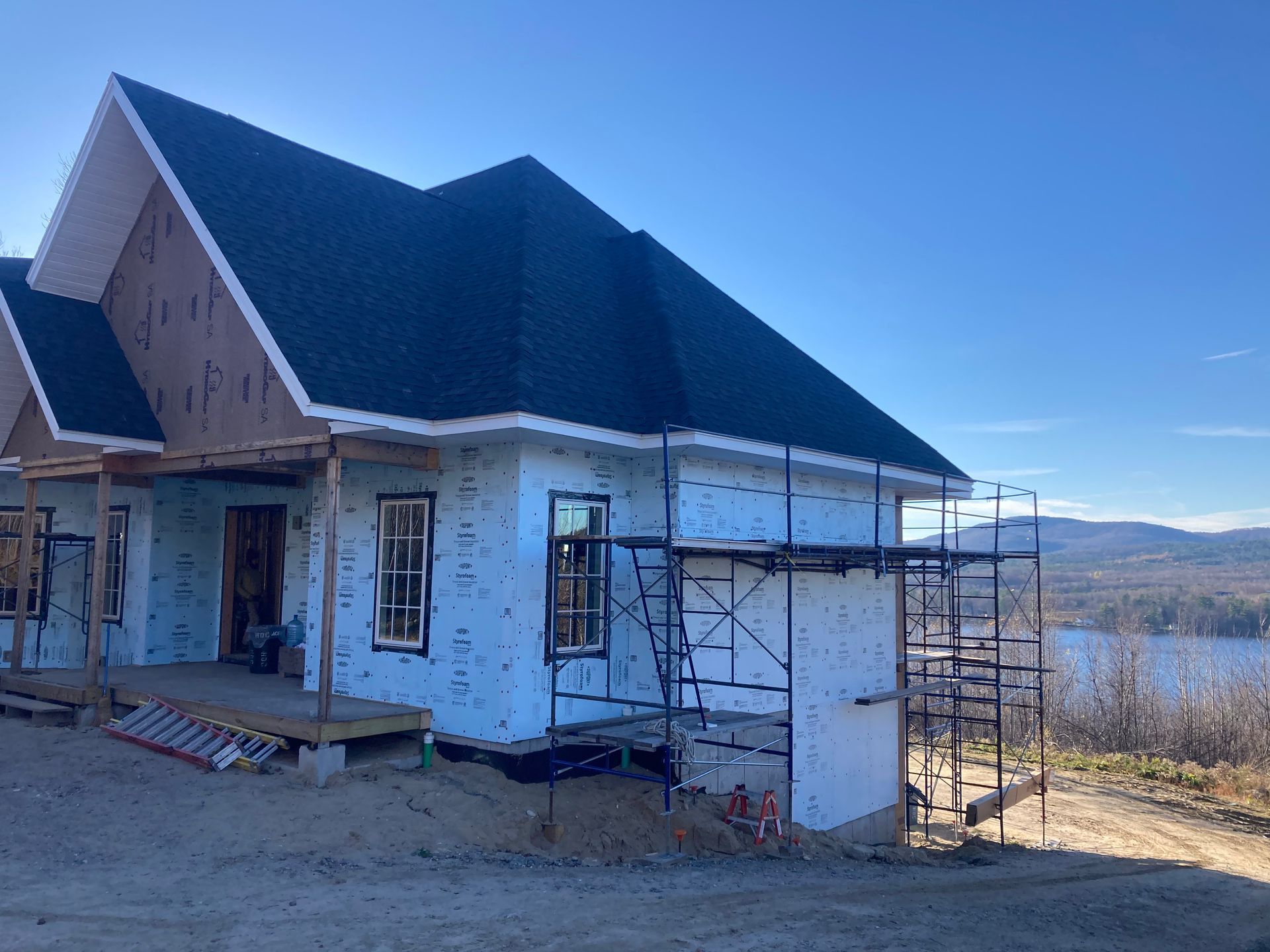 A house that is being built with a green roof