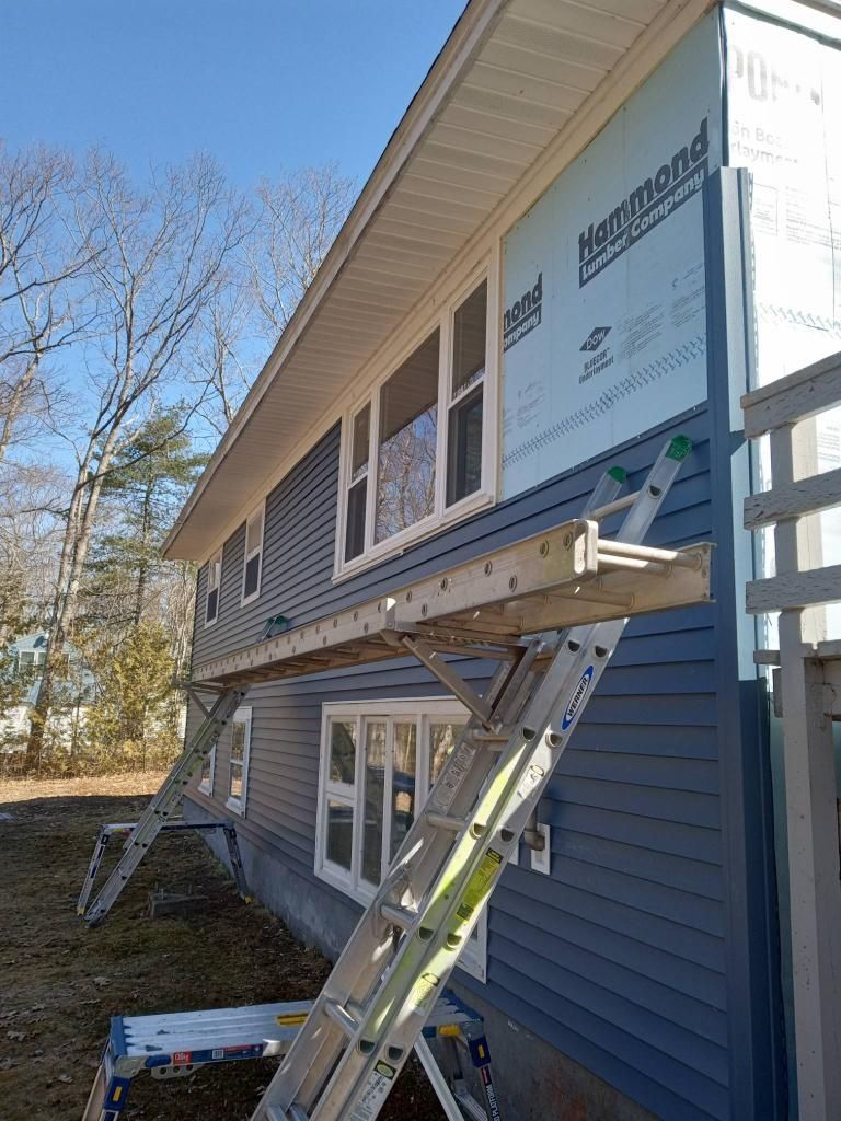 A ladder is attached to the side of a house.