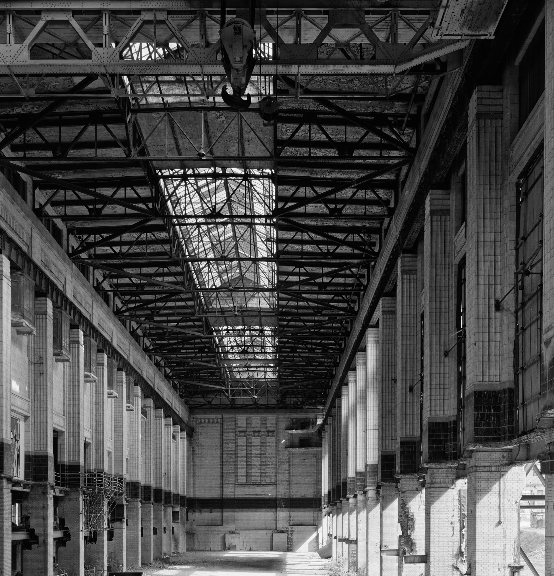 A black and white photo of a large industrial building