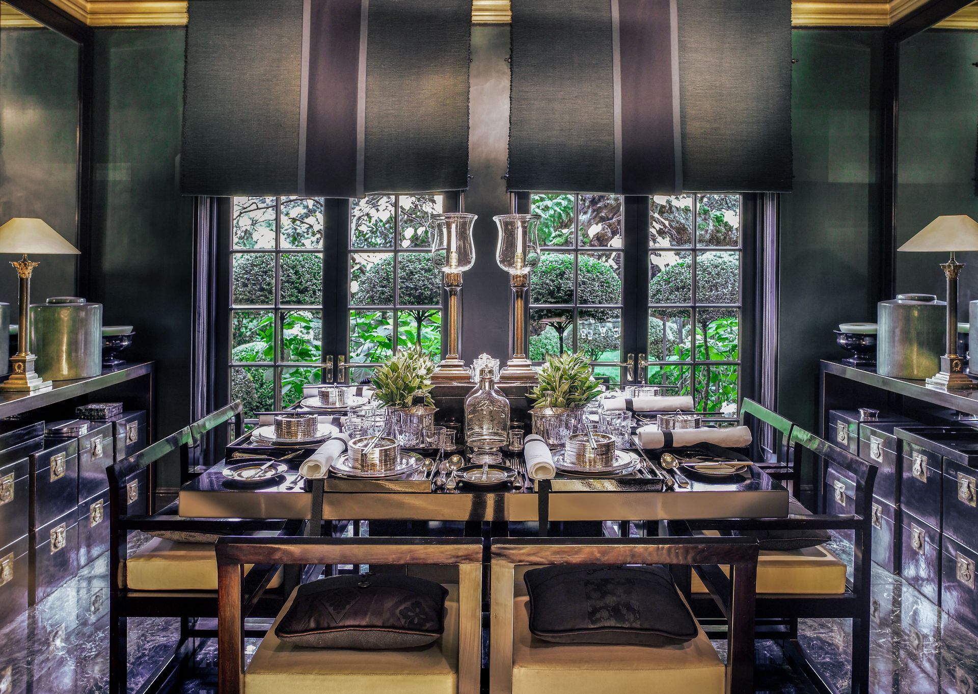 A dining room with a glass table and chairs