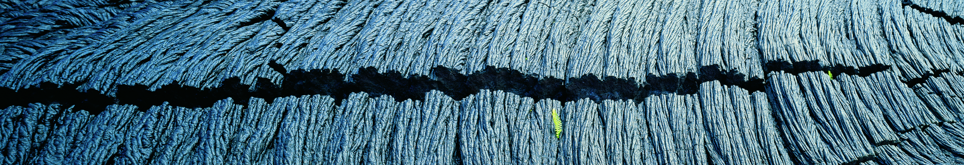 A close up of a blue carpet with a black line on it.