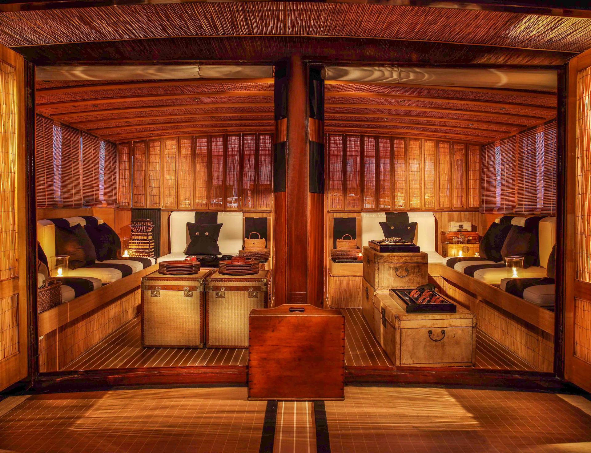 A living room with wooden furniture and a trunk in the middle