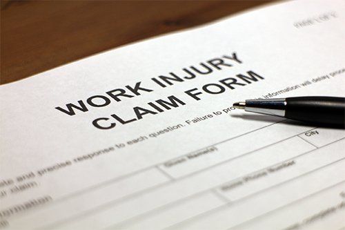 Work Injury Claim Form And Pen