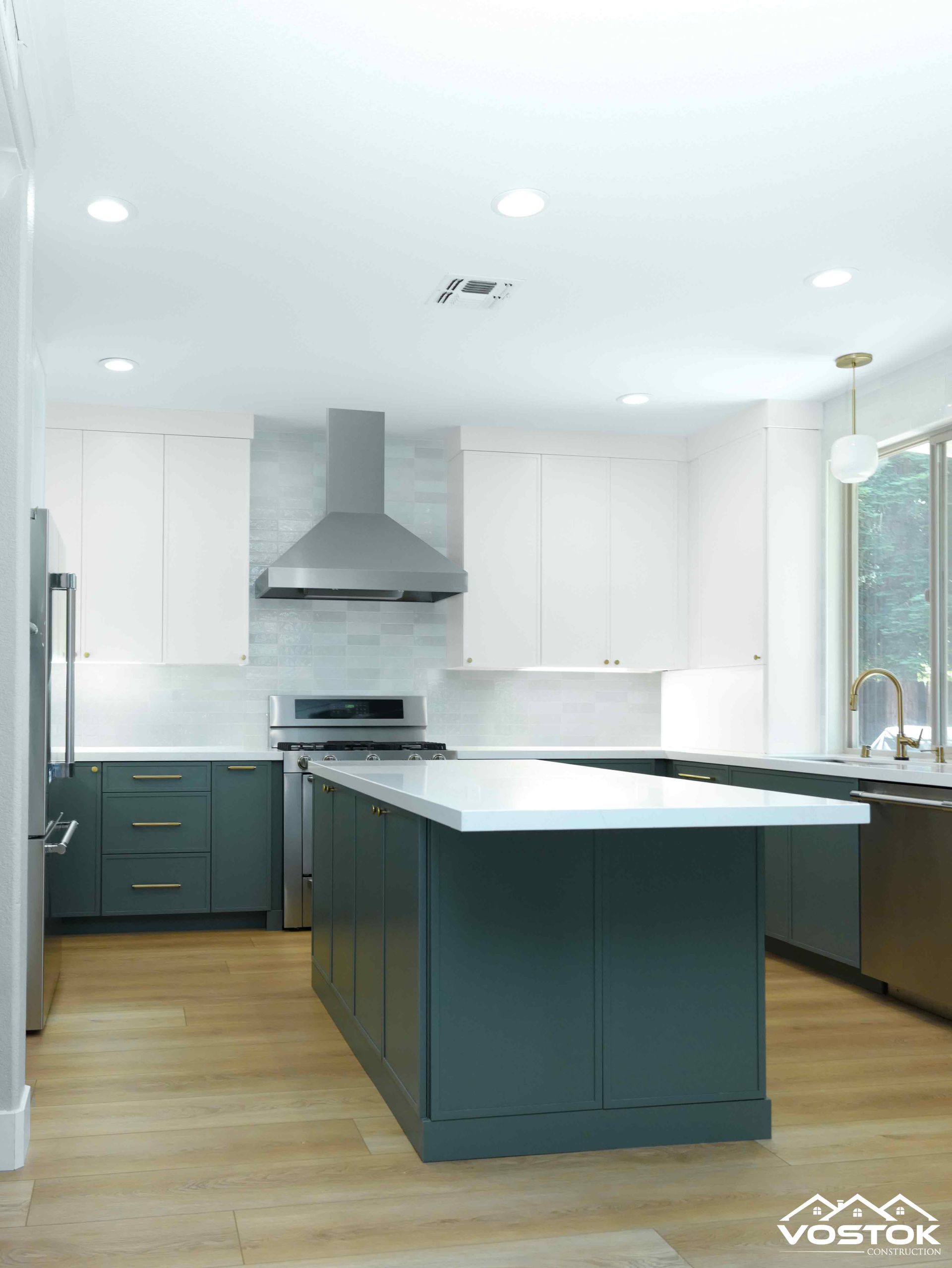 A kitchen with a large island in the middle of it