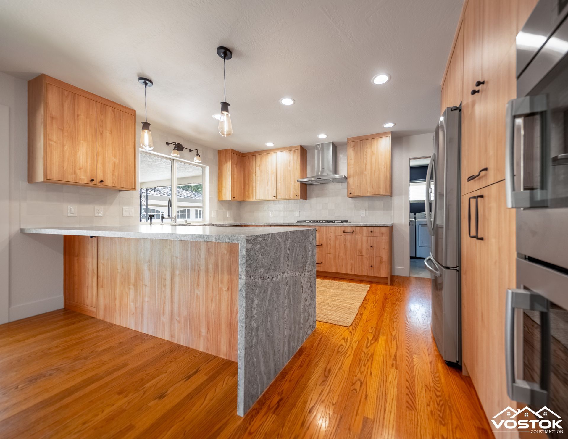 A kitchen with wooden cabinets and stainless steel appliances.
