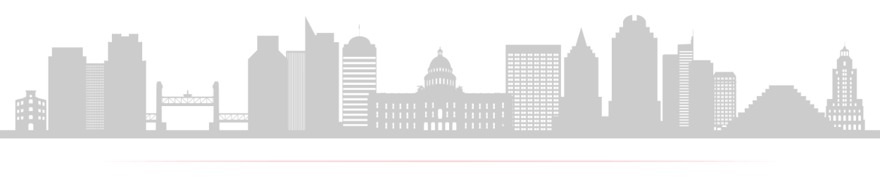 A silhouette of a city skyline with a lot of buildings on a white background.