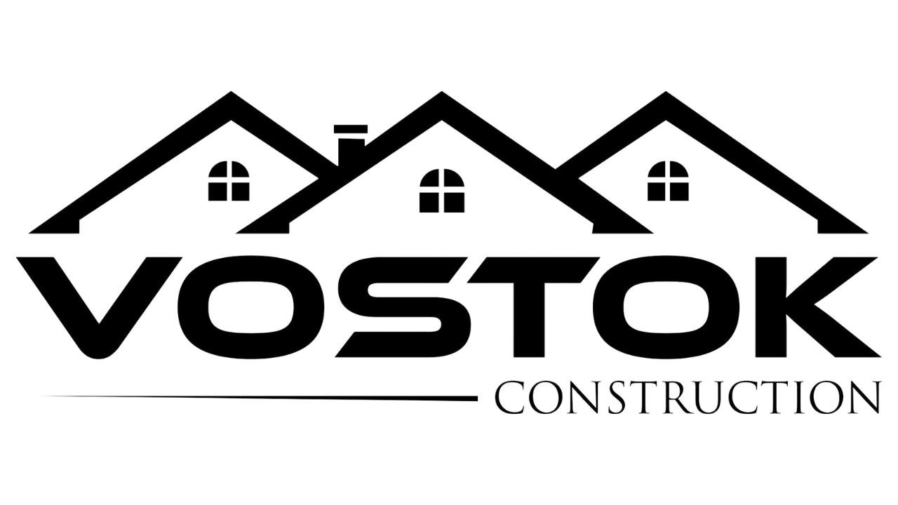 A black and white logo for a construction company called vostok construction.