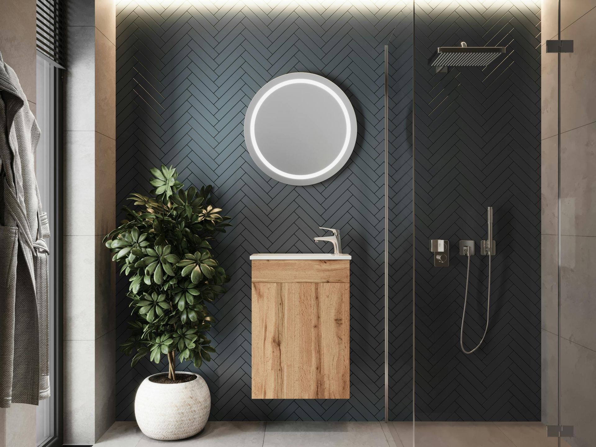 Dark herringbone wall tiles behind a modern vanity and glass shower enclosure.