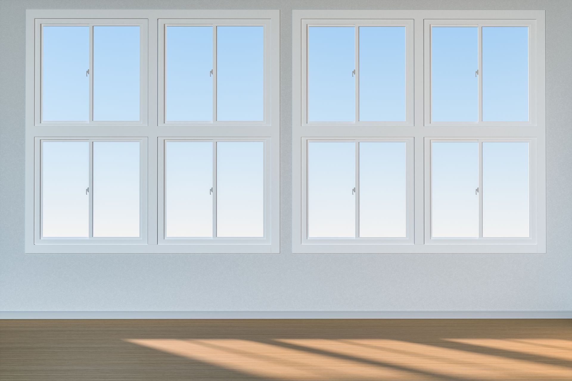 A row of white windows in an empty room