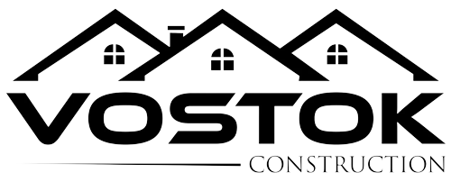 A black and white logo for a construction company called vostok construction.