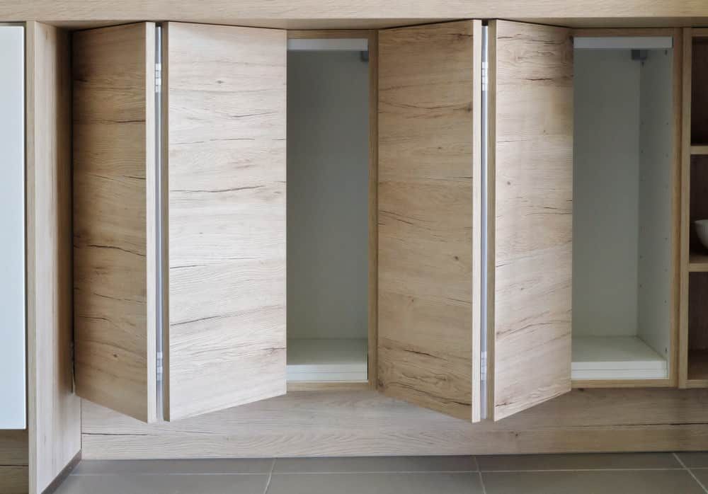 A Wooden Cabinet With The Doors Open And Empty Shelves — South East Kitchens In Burleigh Heads, QLD