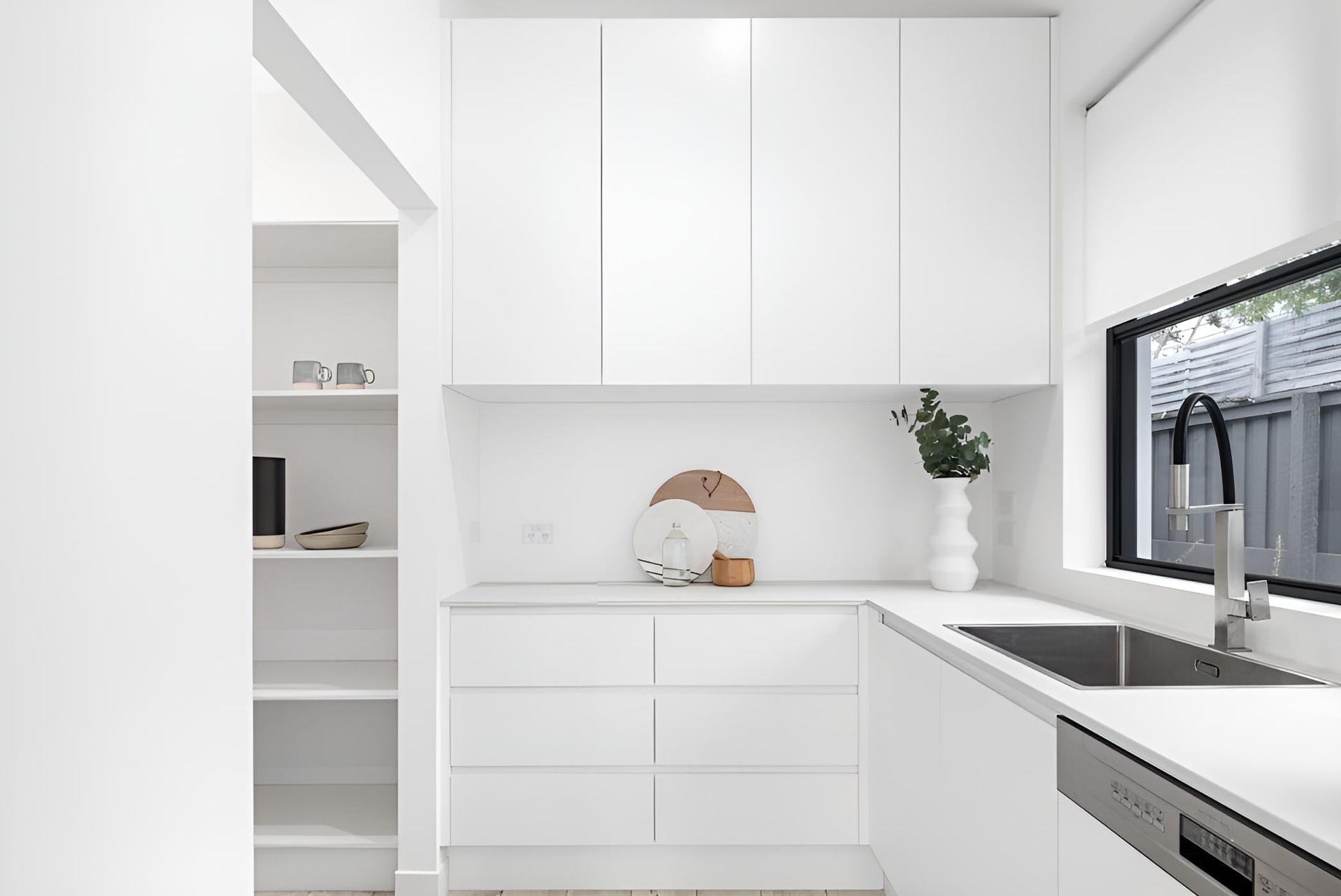 A Kitchen With White Cabinets, A Sink, And A Window — South East Kitchens In Burleigh Heads, QLD