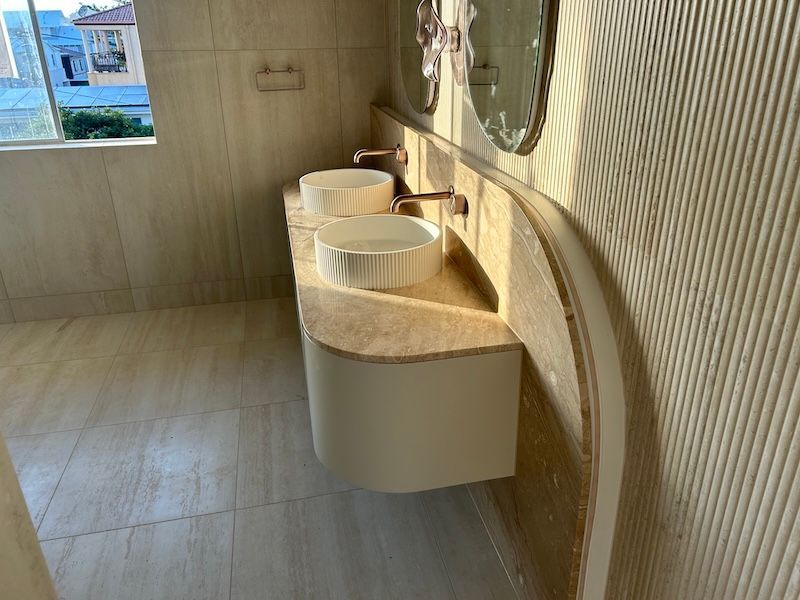 A Bathroom Floating Bench Gold Sink with Stone Cream Tiles - South East Kitchens, Burleigh Heads, QLD