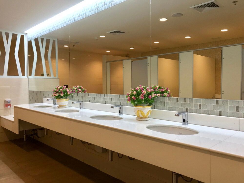 A Public Restroom With A Long Row Of Sinks And Mirrors — South East Kitchens In Brisbane, QLD