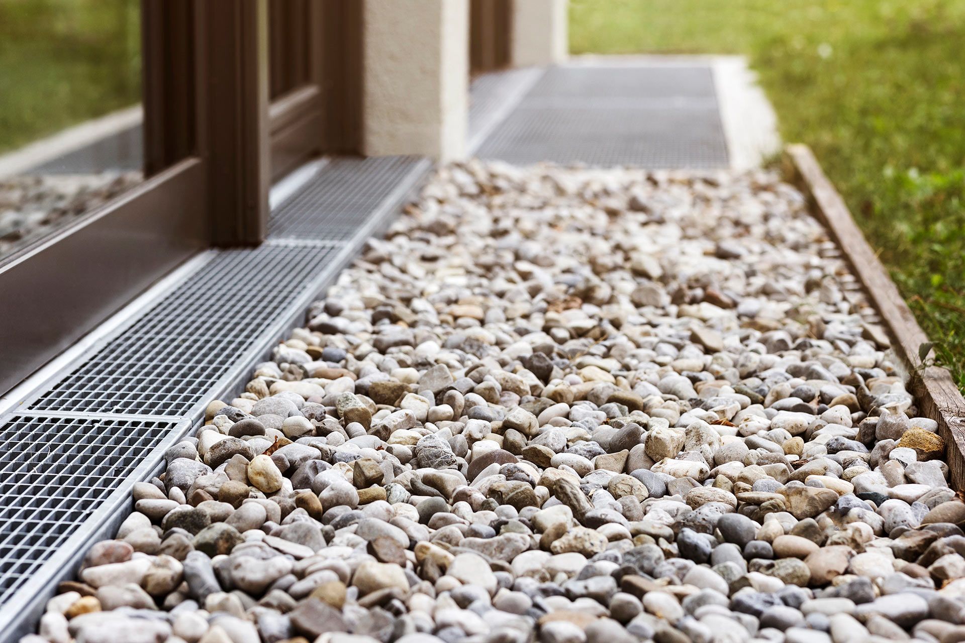 Pressure washer cleaning a gutter.